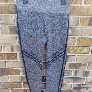 Leggings Pants size Medium with black pin stripes.